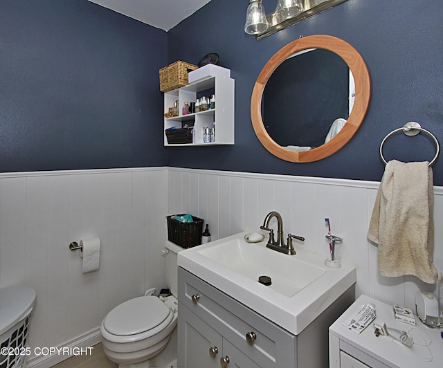 213 Lee Dr, Homer, AK 99603 - bathroom with vanity and a wainscoted wall