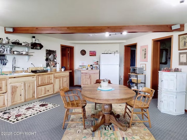 60871 Bear Creek Dr, Homer, AK 99603 - dining room with dark colored carpet, beam ceiling, and wet bar