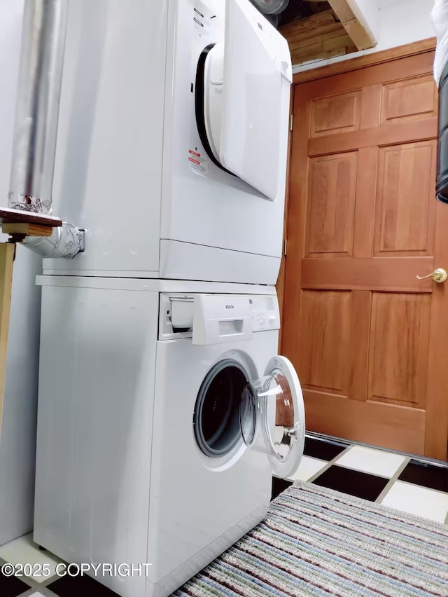 60871 Bear Creek Dr, Homer, AK 99603 - laundry room featuring stacked washer and clothes dryer
