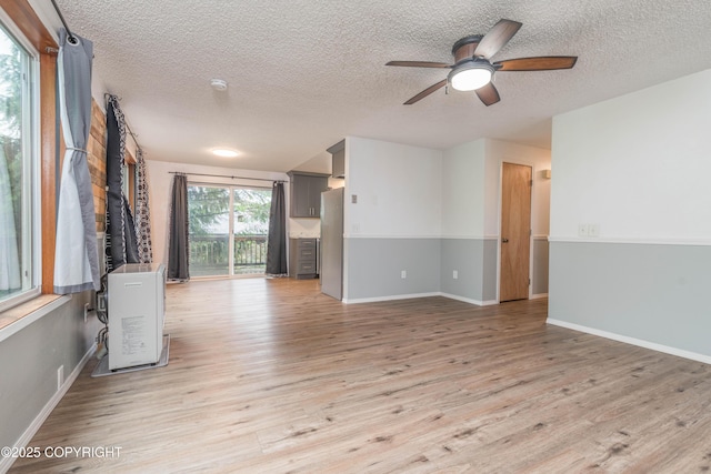 3237 Lincoln Ct, Ketchikan, AK 99901 - unfurnished room with a textured ceiling, wood finished floors, and a ceiling fan