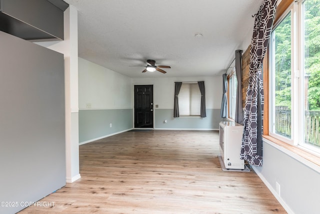 3237 Lincoln Ct, Ketchikan, AK 99901 - spare room featuring ceiling fan, plenty of natural light, wood finished floors, and a textured ceiling