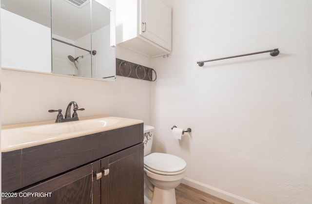 3237 Lincoln Ct, Ketchikan, AK 99901 - bathroom with wood finished floors, vanity, and a shower
