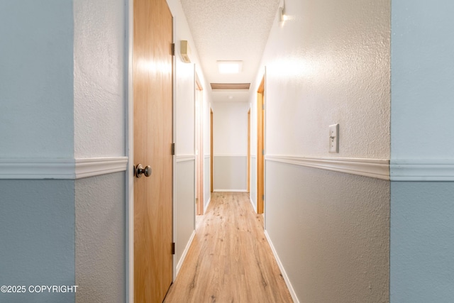 3237 Lincoln Ct, Ketchikan, AK 99901 - hall featuring a textured wall and wood finished floors