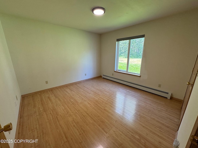 16297 E Harter Dr, Palmer, AK 99645 - spare room with baseboard heating and wood finished floors