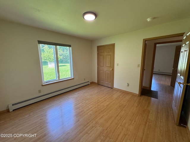 16297 E Harter Dr, Palmer, AK 99645 - spare room with baseboard heating, light wood-style floors, and a smoke detector