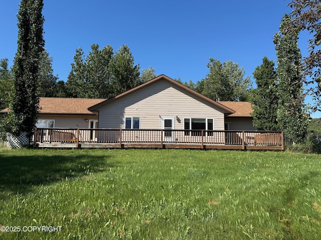 16297 E Harter Dr, Palmer, AK 99645 - rear view of house with a wooden deck, a lawn, and roof with shingles