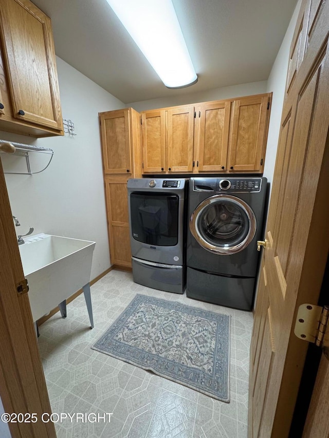 16297 E Harter Dr, Palmer, AK 99645 - laundry room with cabinet space, washer and clothes dryer, and light floors