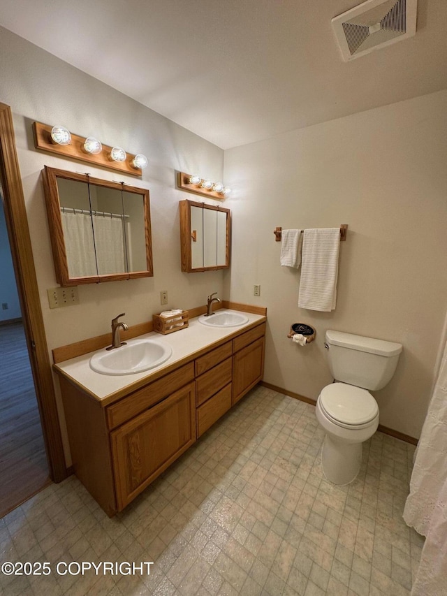 16297 E Harter Dr, Palmer, AK 99645 - full bathroom featuring double vanity and tile patterned floors