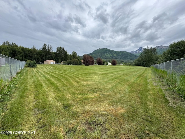 16297 E Harter Dr, Palmer, AK 99645 - view of yard featuring a mountain view, a view of rural / pastoral area, and a storage unit