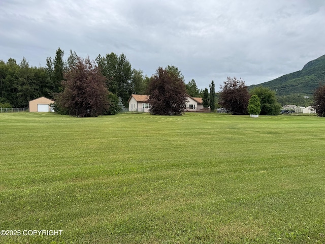 16297 E Harter Dr, Palmer, AK 99645 - view of green lawn with a detached garage and a mountain view