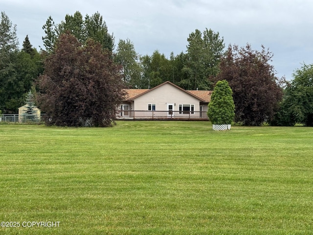 16297 E Harter Dr, Palmer, AK 99645 - view of green lawn with a deck