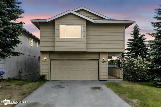 10300 Ridge Park Dr, Anchorage, AK 99507 - view of front of house featuring a garage and asphalt driveway