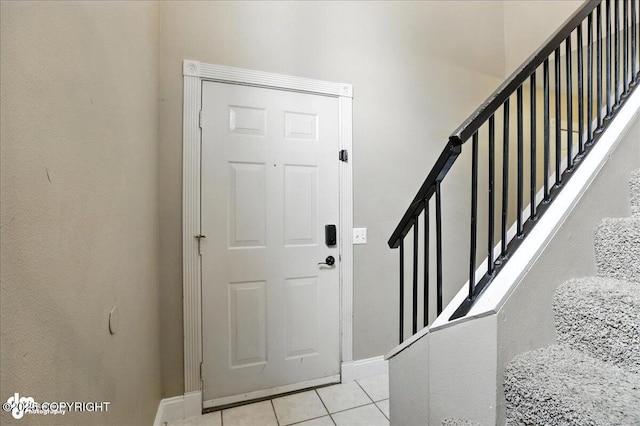 10300 Ridge Park Dr, Anchorage, AK 99507 - foyer entrance featuring light tile patterned floors and stairway