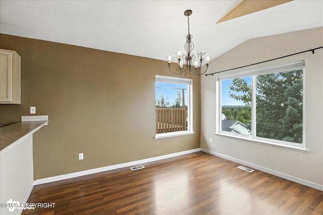 10300 Ridge Park Dr, Anchorage, AK 99507 - unfurnished dining area with vaulted ceiling, a chandelier, and dark wood-type flooring