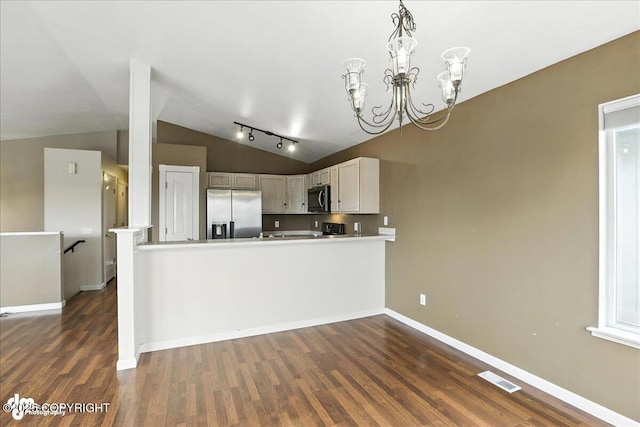10300 Ridge Park Dr, Anchorage, AK 99507 - kitchen featuring stainless steel fridge, lofted ceiling, dark wood-style flooring, light countertops, and a chandelier