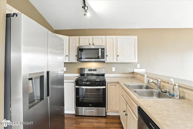 10300 Ridge Park Dr, Anchorage, AK 99507 - kitchen featuring appliances with stainless steel finishes, light countertops, dark wood finished floors, and track lighting