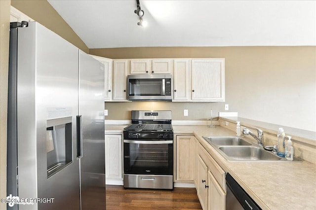 10300 Ridge Park Dr, Anchorage, AK 99507 - kitchen featuring stainless steel appliances, light countertops, dark wood-style flooring, and rail lighting