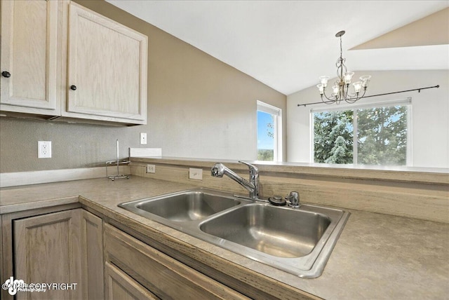 10300 Ridge Park Dr, Anchorage, AK 99507 - kitchen with vaulted ceiling, a chandelier, light countertops, hanging light fixtures, and a peninsula