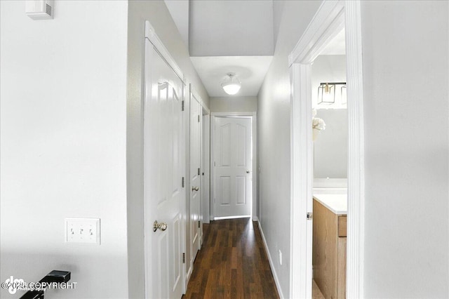 10300 Ridge Park Dr, Anchorage, AK 99507 - hall featuring dark wood-type flooring and baseboards