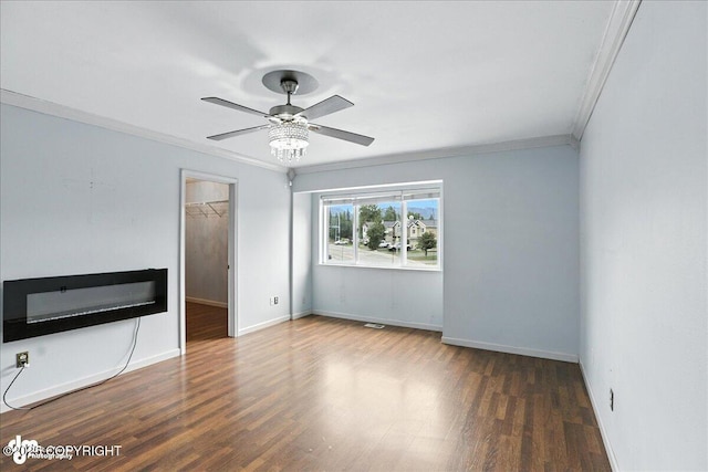 10300 Ridge Park Dr, Anchorage, AK 99507 - unfurnished living room with crown molding, wood finished floors, and ceiling fan