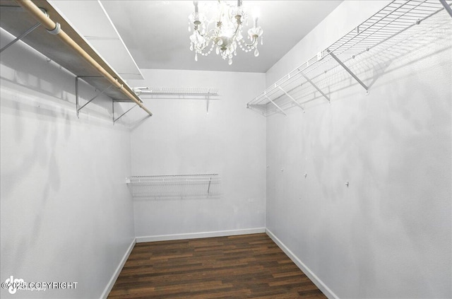 10300 Ridge Park Dr, Anchorage, AK 99507 - spacious closet with wood finished floors and a chandelier