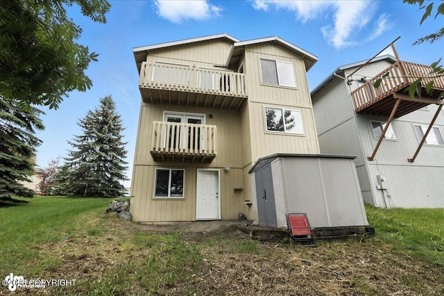 10300 Ridge Park Dr, Anchorage, AK 99507 - back of property with a balcony and a lawn