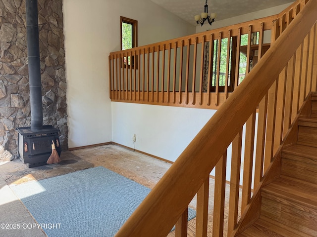 4261 E Foxtrot Ave, Wasilla, AK 99654 - stairs featuring a wood stove and baseboards