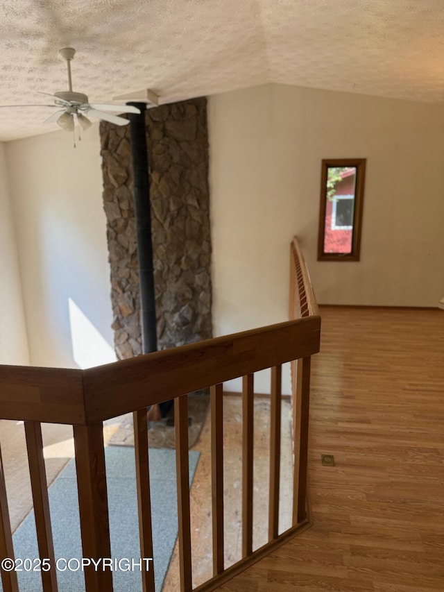 4261 E Foxtrot Ave, Wasilla, AK 99654 - staircase with a textured ceiling, a ceiling fan, and wood finished floors