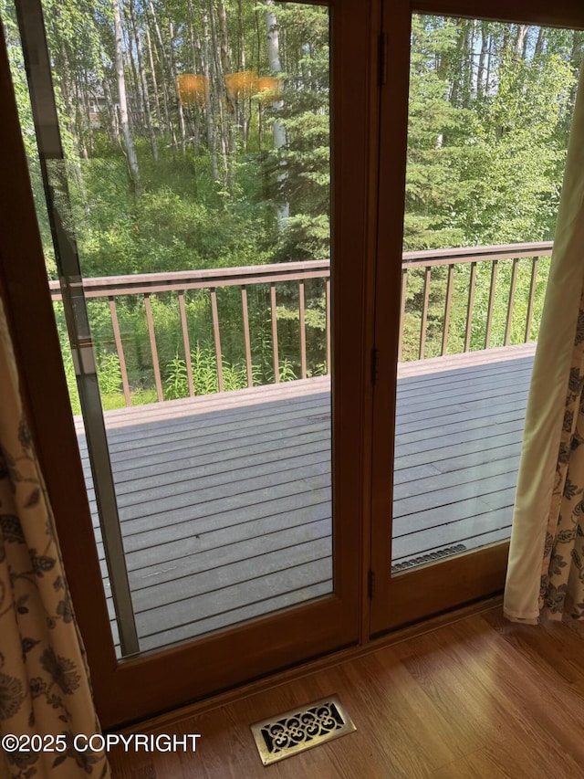 4261 E Foxtrot Ave, Wasilla, AK 99654 - doorway to outside featuring wood finished floors