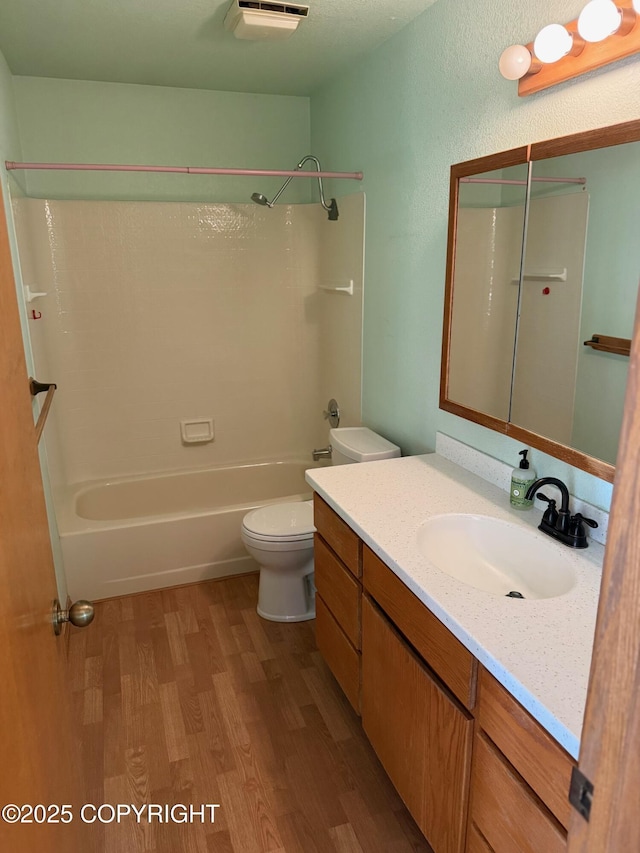 4261 E Foxtrot Ave, Wasilla, AK 99654 - full bathroom with wood finished floors, vanity, and bathing tub / shower combination