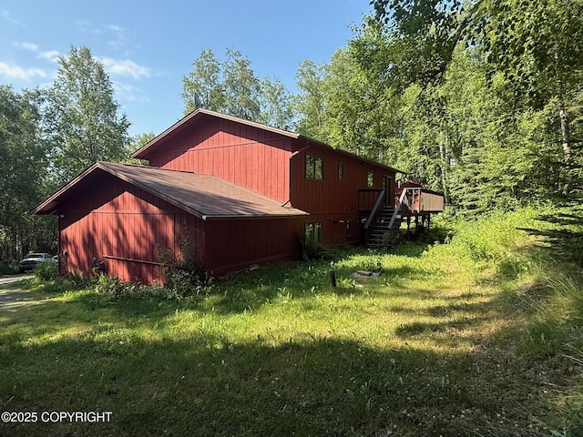 4261 E Foxtrot Ave, Wasilla, AK 99654 - view of side of property featuring stairs, a yard, and a deck