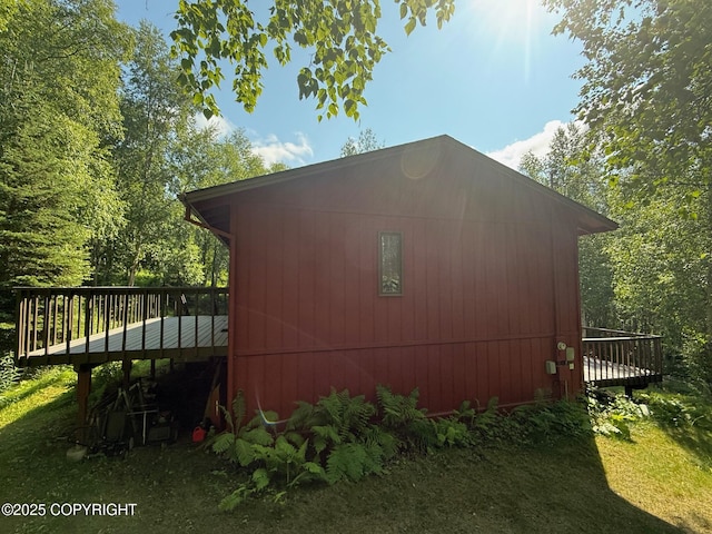 4261 E Foxtrot Ave, Wasilla, AK 99654 - view of side of home featuring a deck