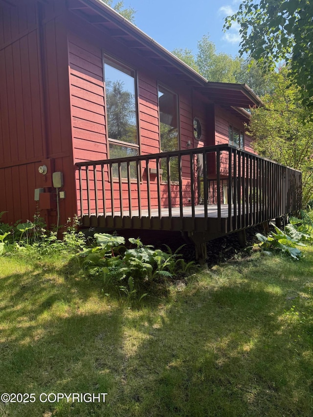 4261 E Foxtrot Ave, Wasilla, AK 99654 - view of side of property with a wooden deck and a lawn