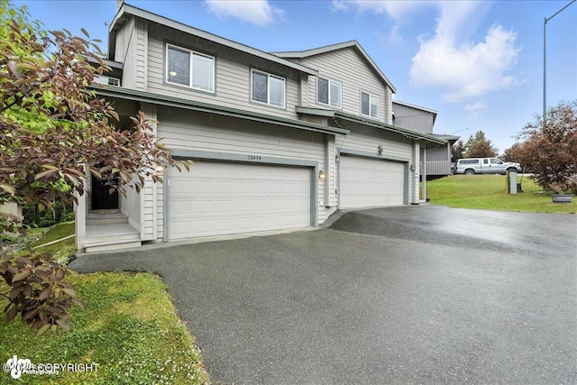 20454 Icefall Dr, Eagle River, AK 99577 - view of front of house featuring a garage and asphalt driveway