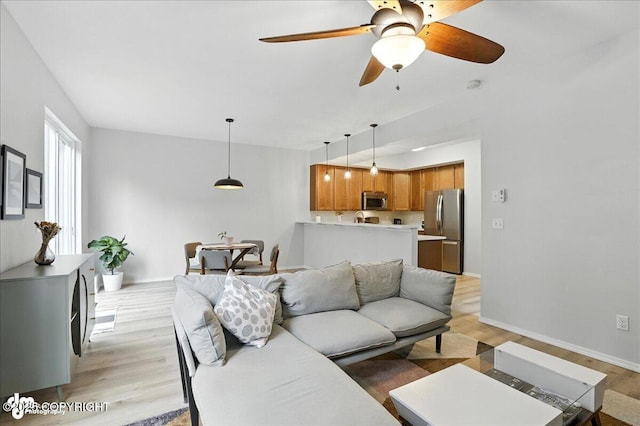 20454 Icefall Dr, Eagle River, AK 99577 - living room featuring light wood-style floors and ceiling fan