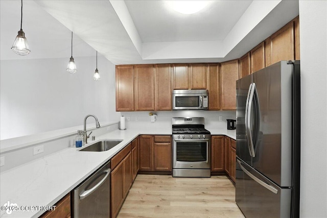 20454 Icefall Dr, Eagle River, AK 99577 - kitchen with appliances with stainless steel finishes, brown cabinetry, and light wood-type flooring