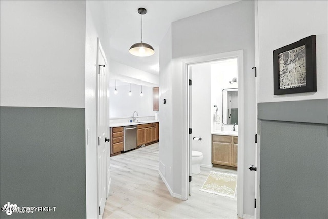 20454 Icefall Dr, Eagle River, AK 99577 - hall with light wood-type flooring and a sink