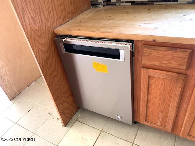7367 S Rubacaba St, Wasilla, AK 99623 - detailed view of dishwasher and brown cabinets