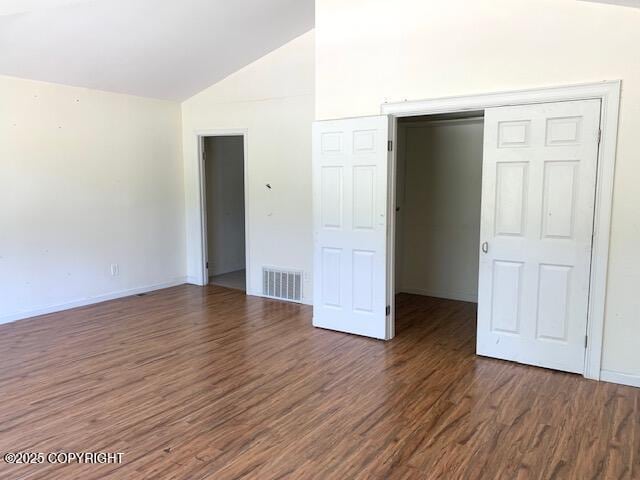 7367 S Rubacaba St, Wasilla, AK 99623 - unfurnished bedroom with vaulted ceiling and wood finished floors