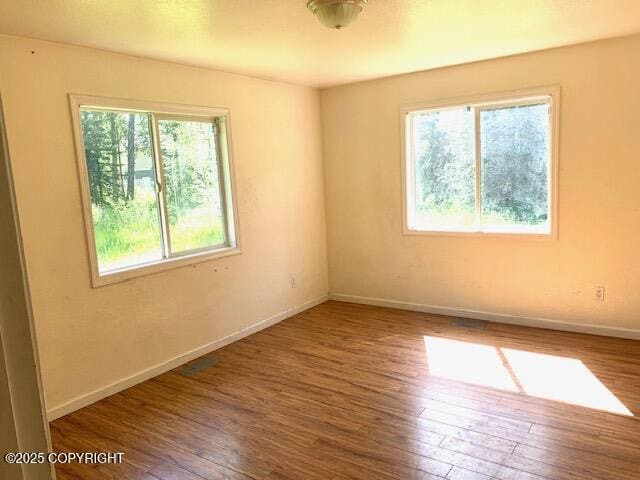 7367 S Rubacaba St, Wasilla, AK 99623 - spare room featuring wood finished floors and baseboards