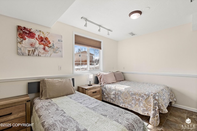 8430 Greenhill Way, Anchorage, AK 99502 - bedroom with rail lighting and baseboards