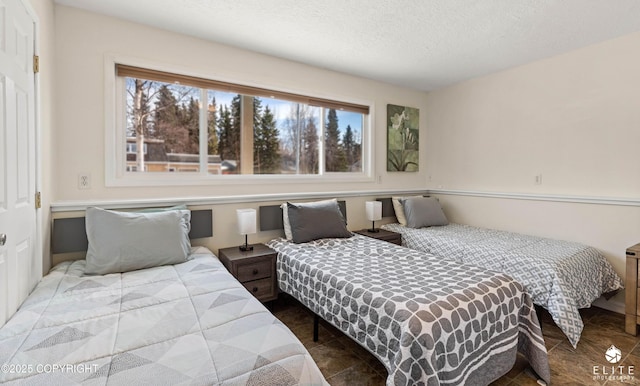 8430 Greenhill Way, Anchorage, AK 99502 - bedroom with multiple windows, a textured ceiling, and tile patterned flooring