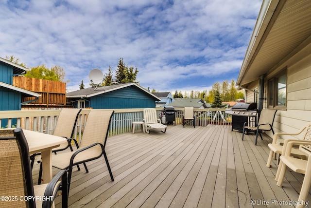 8430 Greenhill Way, Anchorage, AK 99502 - wooden deck with area for grilling and outdoor dining space
