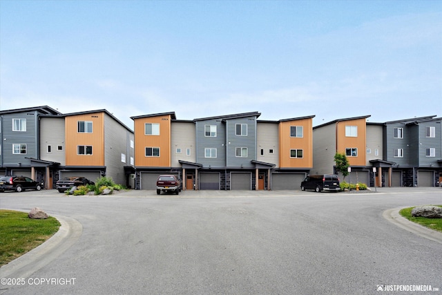 11459 Moonrise Ridge Pl # 7, Anchorage, AK 99516 - view of asphalt road with a residential view