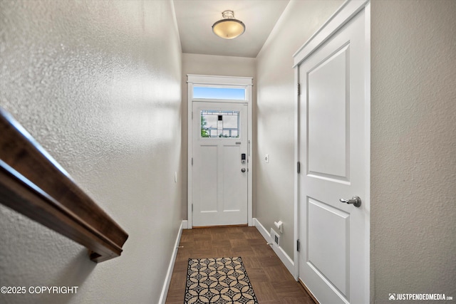 11459 Moonrise Ridge Pl # 7, Anchorage, AK 99516 - entryway featuring baseboards and a textured wall