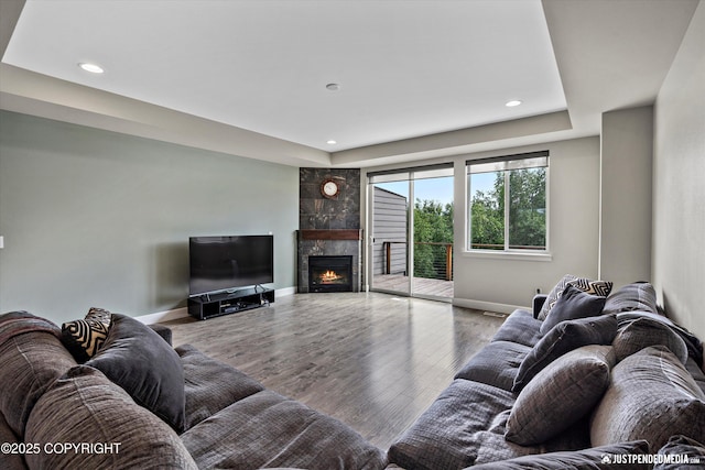 11459 Moonrise Ridge Pl # 7, Anchorage, AK 99516 - living room featuring recessed lighting, wood finished floors, and a tile fireplace