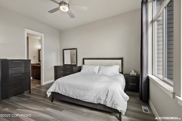 11459 Moonrise Ridge Pl # 7, Anchorage, AK 99516 - bedroom featuring wood finished floors, ensuite bath, and ceiling fan