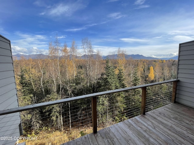 11459 Moonrise Ridge Pl # 7, Anchorage, AK 99516 - wooden deck featuring a mountain view and a view of trees