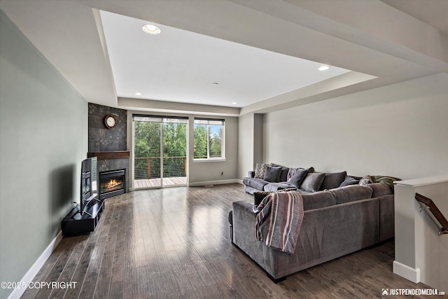 11459 Moonrise Ridge Pl # 7, Anchorage, AK 99516 - living room with wood finished floors, a tiled fireplace, recessed lighting, and a raised ceiling