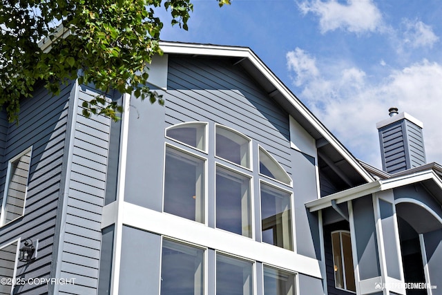 2231 Shore Dr, Anchorage, AK 99515 - view of side of home featuring a chimney
